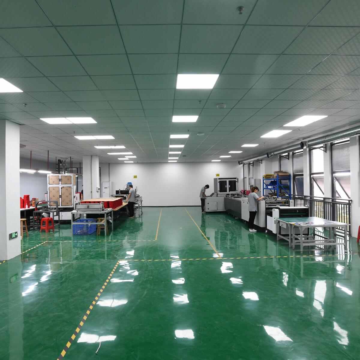rigid box manufacturing factory floor with production and quality control environment