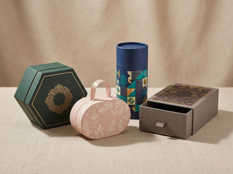 collection of custom shaped rigid boxes including hexagon oval and drawer structures for campaign packaging