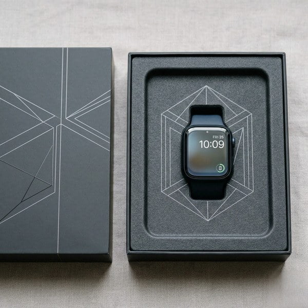 Rigid box with insert designed to securely hold electronic accessories in place