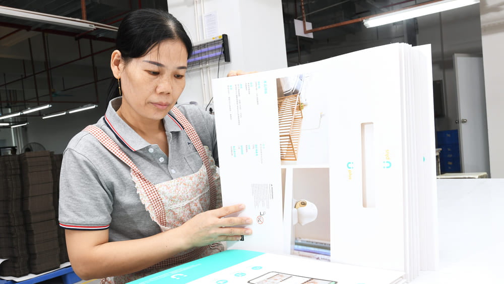 First Article Inspection and IPQC checking printed packaging against an approved customer sample during production